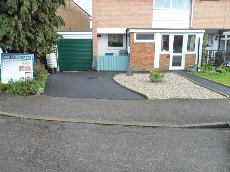 Driveway with replacement tarmac and gravel garden.