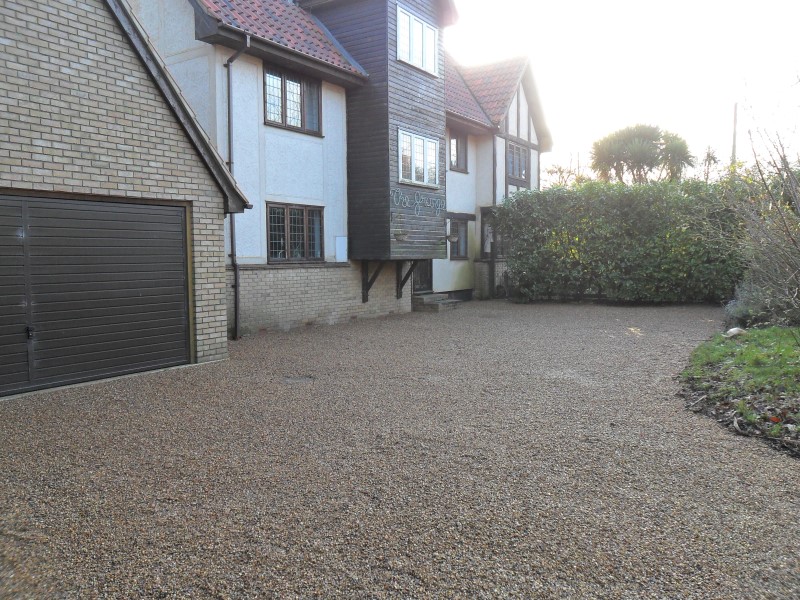 Finished job showing replacement gravel driveway.