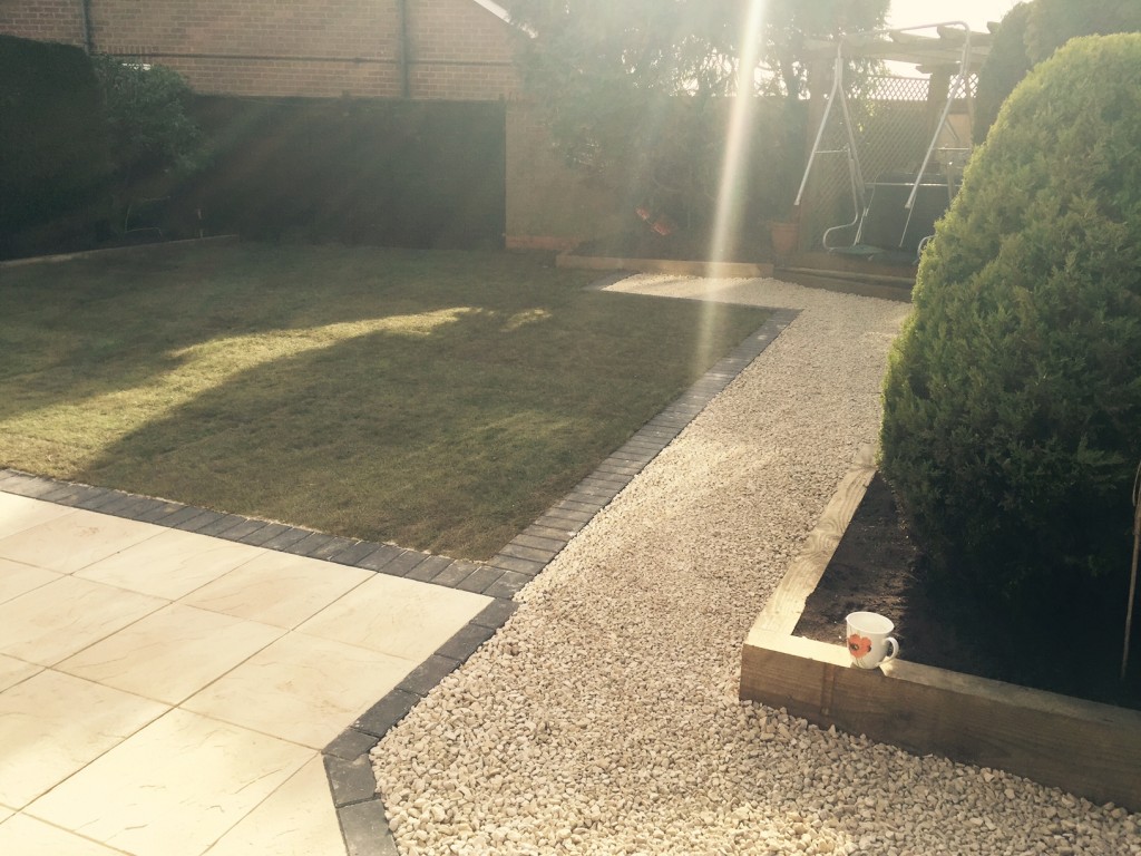 Completed Job showing gravel pathway and retaining edge for flower beds using railway sleeper